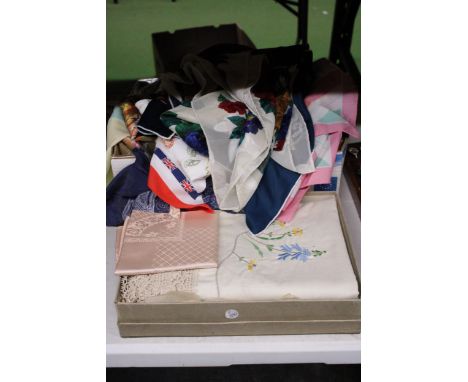 A COLLECTION OF LINNEN AND COTTON TABLE CLOTHS PLUS A LARGE QUANTITY OF VINTAGE SILK, SATIN AND FABRIC SCARVES