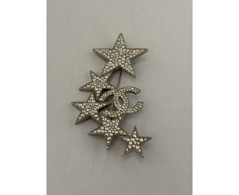 A CHANEL CLEAR STONE STAR BROOCH