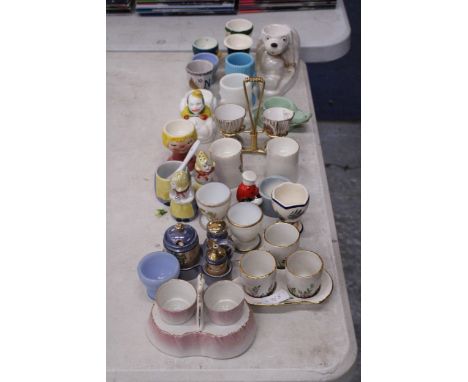 A COLLECTION OF NOVELTY EGG CUPS AND CRUETS TO INCLUDE GOEBEL AND CARLTON WARE