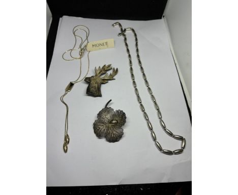 A MARKED SILVER VINTAGE FILAGREE BROOCH IN A FLOWER DESIGN, TWO MONET NECKLACES AND A VINTAGE STAG BROOCH