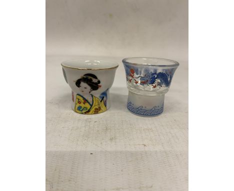 TWO VINTAGE SAKE PEEK-A-BOO GLASSES WITH EROTIC IMAGES TO THE BOTTOMS OF THE GLASSES