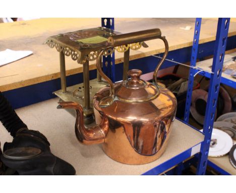 A VINTAGE BRASS TRIVET STAND AND A COPPER KETTLE