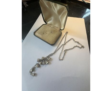 A VINTAGE MARKED SILVER NECKLACE WITH COW BELL CHARMS IN A PRESENTATION BOX
