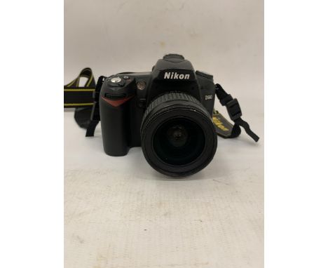A NIKON D90 CAMERA WITH A 50MM LENS