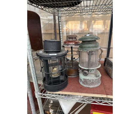 THREE VARIOUS VINTAGE OIL LANTERNS (ONE MISSING THE GLASS)