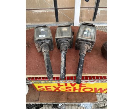THREE VINTAGE METAL COACHING LAMPS