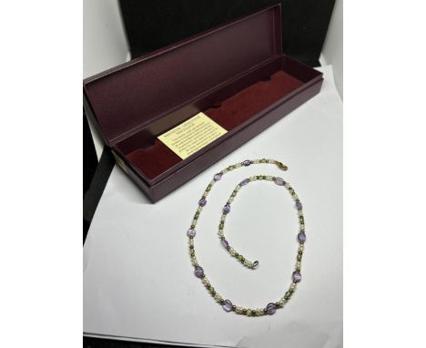 A PAST TIMES MEDIEVAL GEMSTONE NECKLACE MADE UP OF PERIDOTS, AMETHYST AND PEARL WITH GOLD PLATED BEADS AND CLASP IN A PRESENT