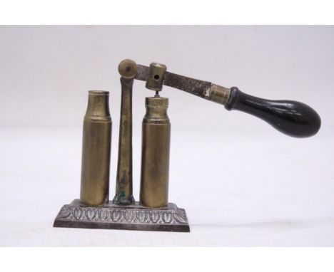 AN UNUSUAL VINTAGE BRASS BULLET CAP SEALER