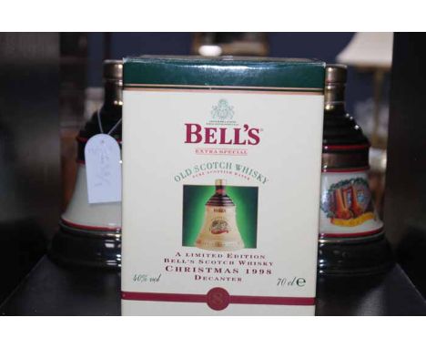 3 BELL'S DECANTERS
Includes: BELL'S CHRISTMAS 1991 BELL (2)
Blended Scotch Whisky in green and cream Wade ceramic decanter. 7