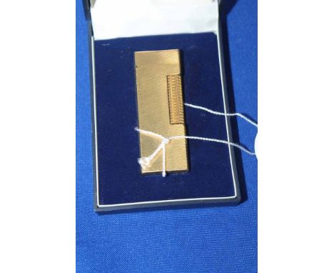 VINTAGE GOLD PLATED DUNHILL ROLLAGAS LIGHTER
with engine turned design, with its original box and papers 