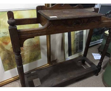 EDWARDIAN OAK LOW HALL STAND
modelled with two umbrellas/stick holds on either side of of a single drawer, on slender support