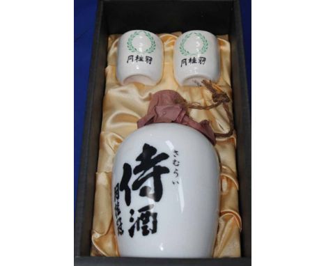 JAPANESE GEKKEIKAN SAKE DECANTER SET
including a ceramic decanter and two Japanese ceramic drinking cups, in original packagi