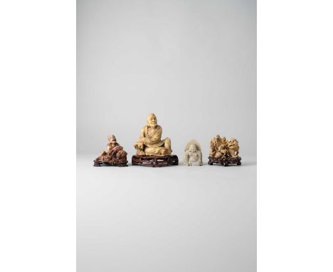 NO RESERVEFOUR CHINESE SOAPSTONE FIGURES 19TH CENTURY AND 20TH CENTURY  One depicting a seated luohan resting on a rocky outc