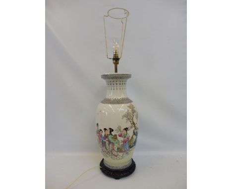 A modern Chinese lamp with shade, 19" high including attached wooden stand.