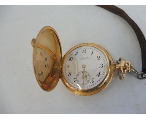 A 14k gold pocket watch.