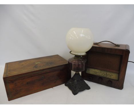 A 19th Century brass inlaid writing slope for restoration, a wooden cased radio and an oil lamp with a purple glass reservoir