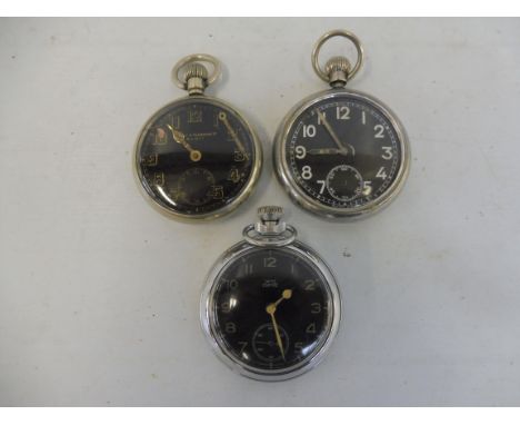 Two black faced military issue pocket watches and a Smiths Empire pocket watch.