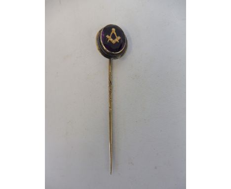 A gold mounted Masonic stick pin.