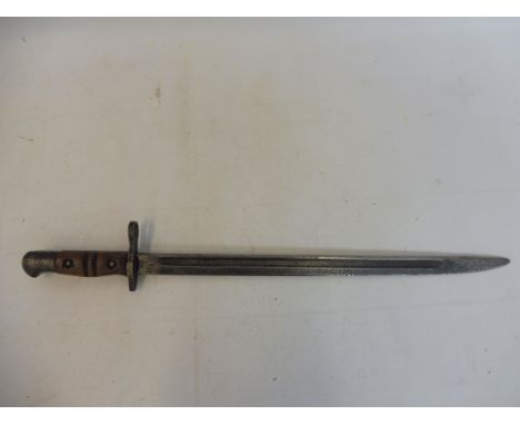 A WWII bayonet by Wilkinson Sword Company London, stamped 49W, War Dept. in leather and steel scabbard, the leather stamped J