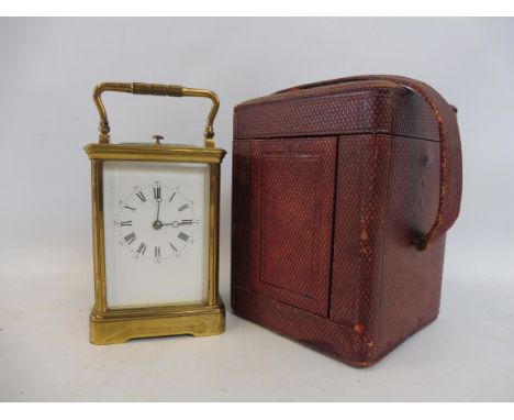 A good quality 19th Century lacquered brass carriage clock with repeater, two keys and original leather travelling case.
