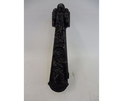 An Arts and Crafts style door knocker.