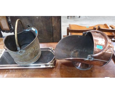 A copper helmet coal scuttle, a brass coal bucket and a fireguard