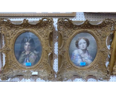 A pair of portrait prints in carved wood and gesso frames. 19th century. The frames 16' x 14' overall