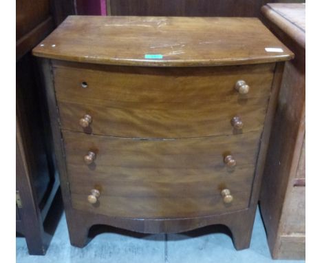 A George III mahogany bowfronted night commode enclosed by two faux drawer cupboard doors raised on bracket feet. 24' wide