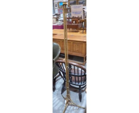A gilt metal lamp standard with triple twist turned column