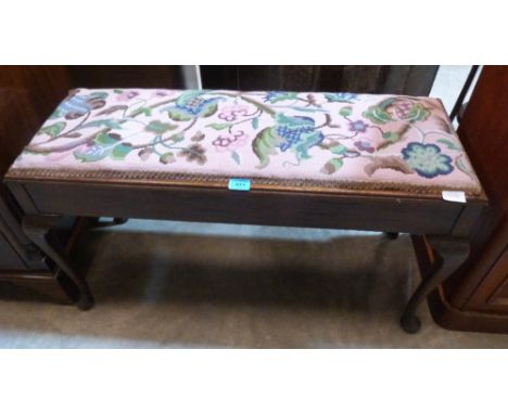 A mahogany duet stool with tapestry lid on cabriole legs. 36' wide