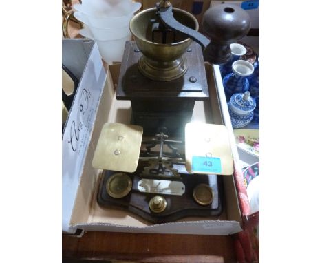 A set of brass postal scales and a coffee grinder