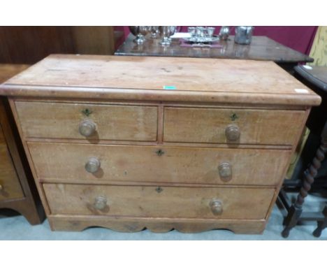 A Victorian pine chest with two short over two long drawers on bracket supports. 41' wide