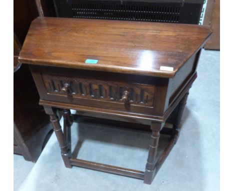 Reprodux Furniture. An oak credence style table with notch carved frieze drawer on ring turned legs. 33' wide 