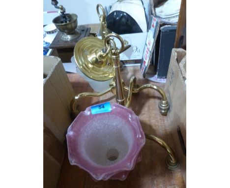 A pair of brass three light hanging lamps with frosted clear or ruby flashed shades
