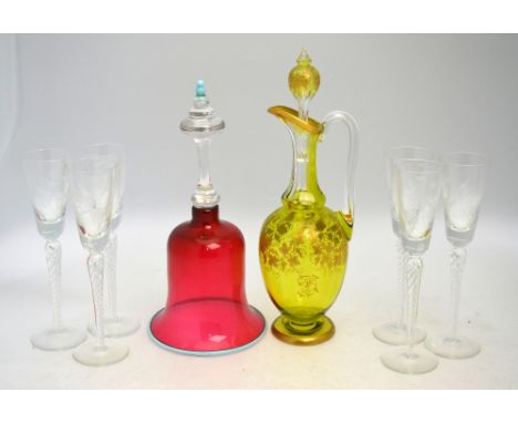 A set of six Champagne flutes; together with a cranberry glass bell, and a yellow-green decanter or claret jug with stopper; 