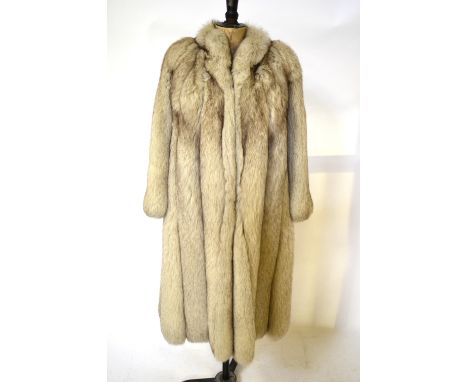 An Arctic fox fur full length coat, with neat collar and belled sleeves, ivory silk satin lining, 47 cm across chest Conditio