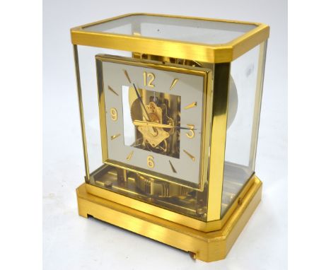 Le Coultre & Cie, a brushed satin brass Atmos clock, no 186578 with white square dial and gilt numerals, 24 cm high (no box) 