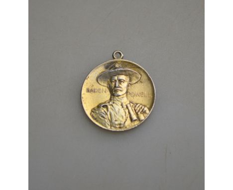 A pendant featuring Baden Powell and motto 'Justice and Empire'