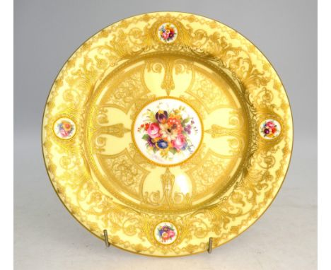 A Royal Worcester cabinet plate, cream ground decorated with ornate classical style raised gilding and handpainted floral rou