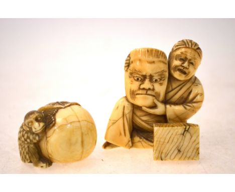 An ivory netsuke, carved as a Monkey beside a large fruit, the leaf stem forming the himotoshi; together with a sectional ivo