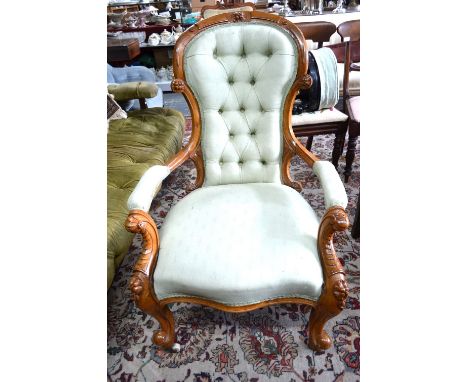 Victorian walnut spoon back armchair with button back over a serpentine seat