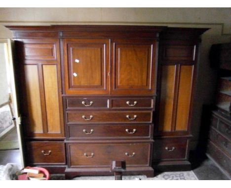 A Georgian break front campactum wardrobe