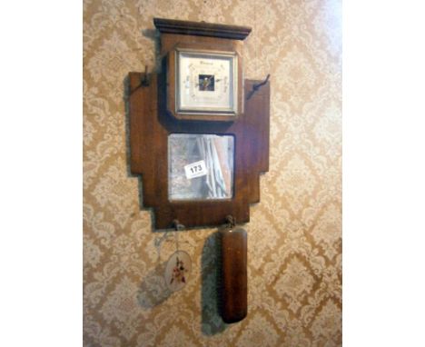 A barometer & brush rack
