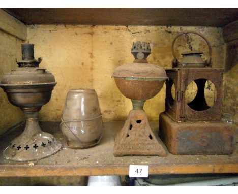 A quantity of old oil lamp bases etc.