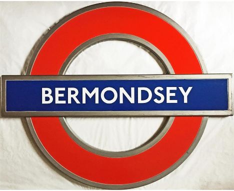 London Underground enamel PLATFORM ROUNDEL SIGN from Bermondsey station on the Jubilee Line. A modern "silhouette" roundel in