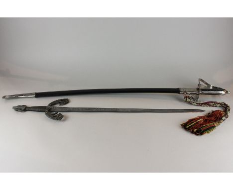 A sabre in scabbard and an ornamental sword