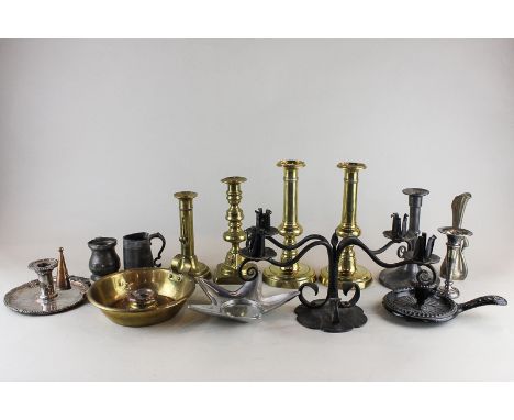 A pair of brass candlesticks, two other brass candlesticks, a plated chamber stick, two other and other metal items