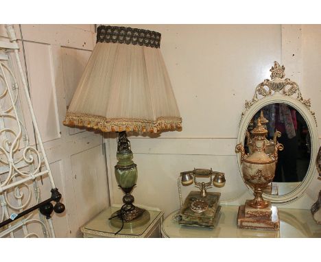 A large green onyx table lamp and shade, a gilt mounted onyx urn ornament and a green onyx telephone