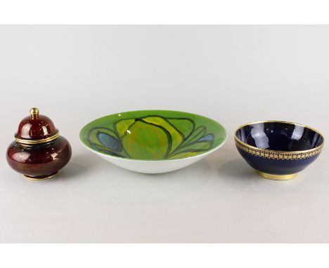 A Carltonware Rouge Royale jar and cover, and a bowl with blue ground and gilt enrichment together with a Poole pottery bowl