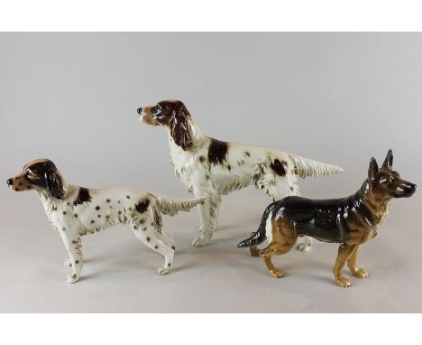 Goebel, three porcelain models of dogs, two setters and an Alsatian